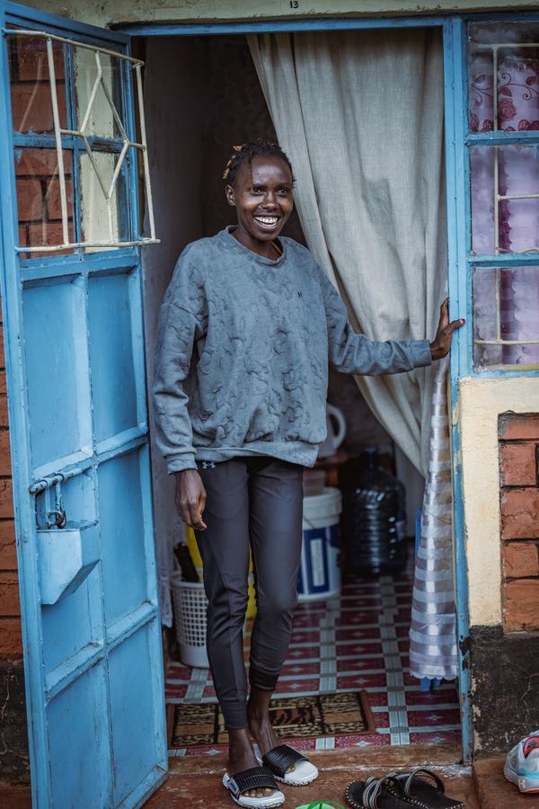 Sharon Lokedi in a blue doorway