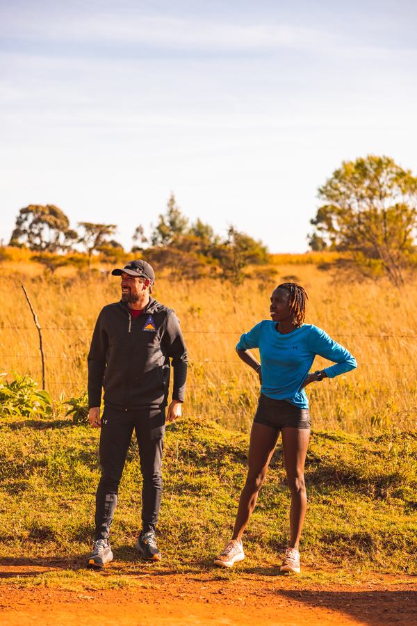 With her coach in the field at golden hour