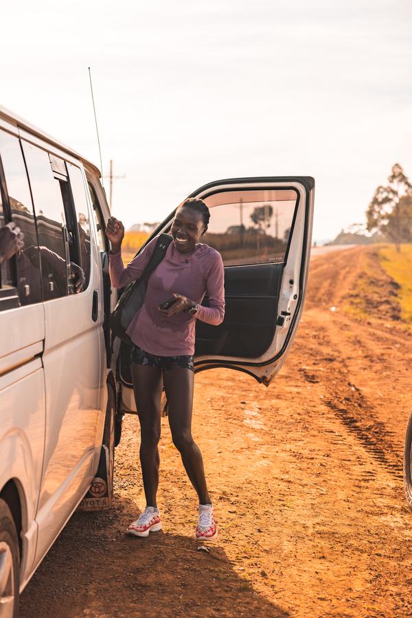 Beside the team van on a dirt road