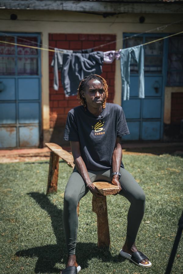 Seated outside, laundry on the line