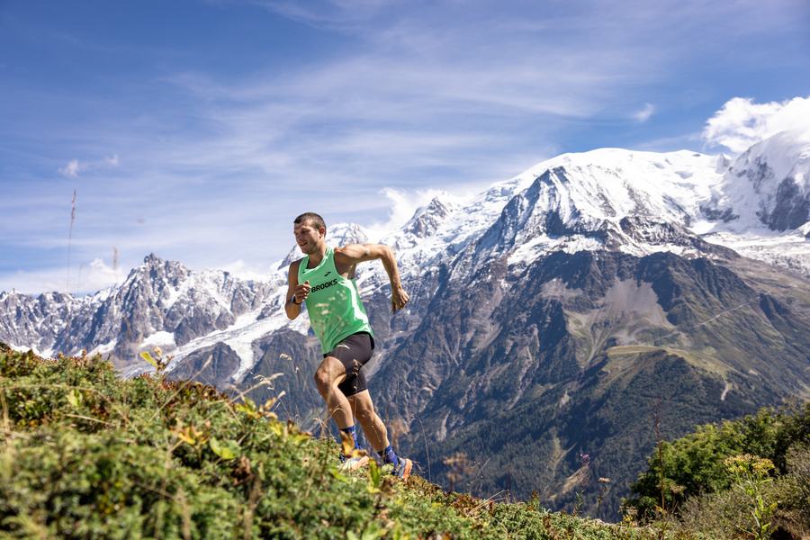Trail runner on the ridge beneath Mont Blanc