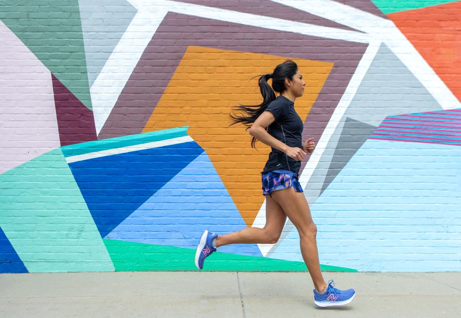 Running past a colorful mural