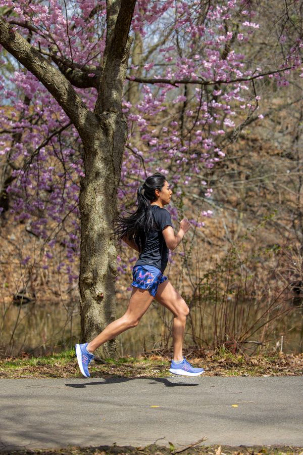 Runner beneath flowering trees