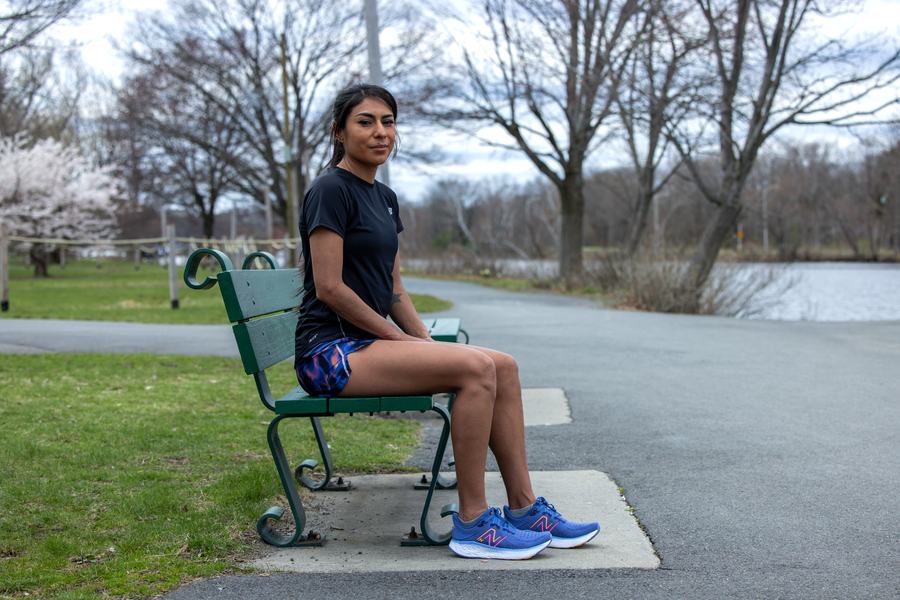 Seated on a bench by the water