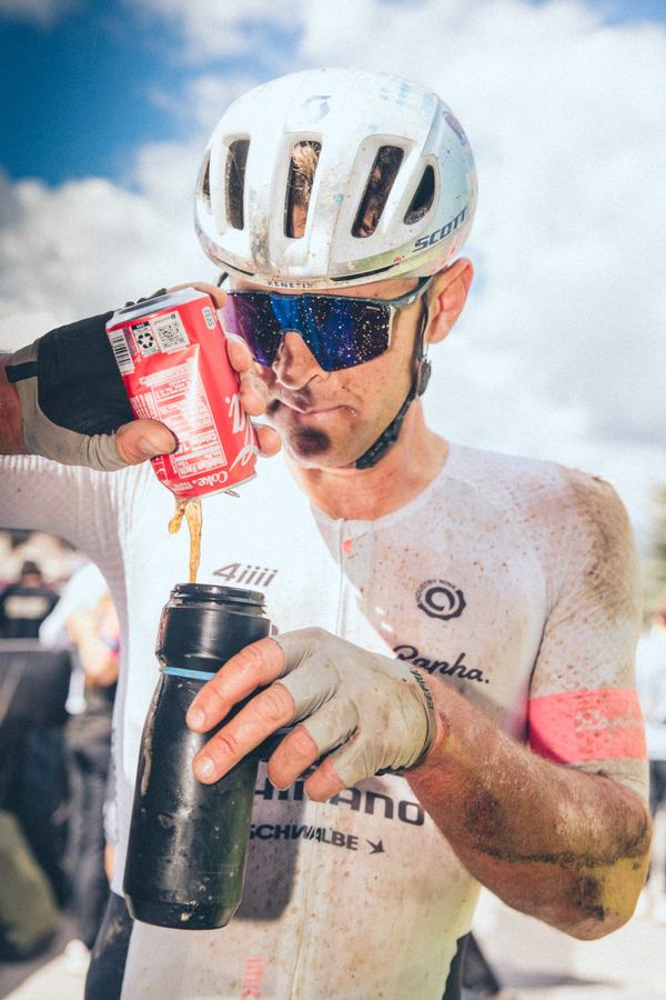 A drink and a breath, mid-race