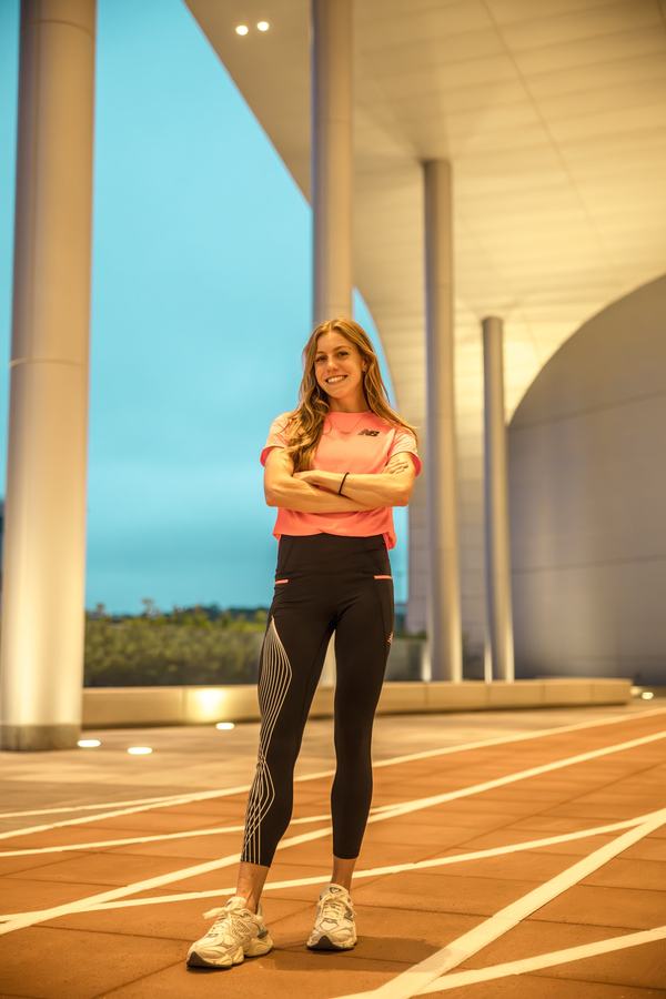 A runner outside the building at blue hour