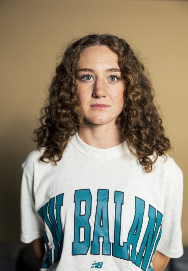 Headshot, curly hair and a vintage tee