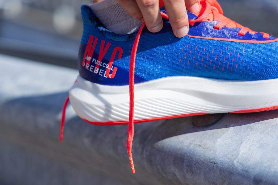 Detail of blue race shoe with red laces