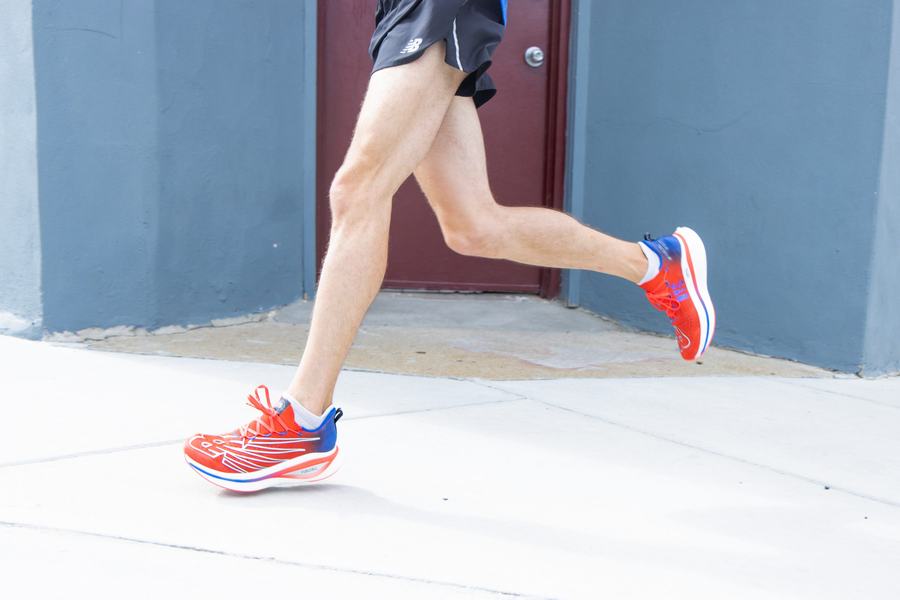Runner passing a blue door