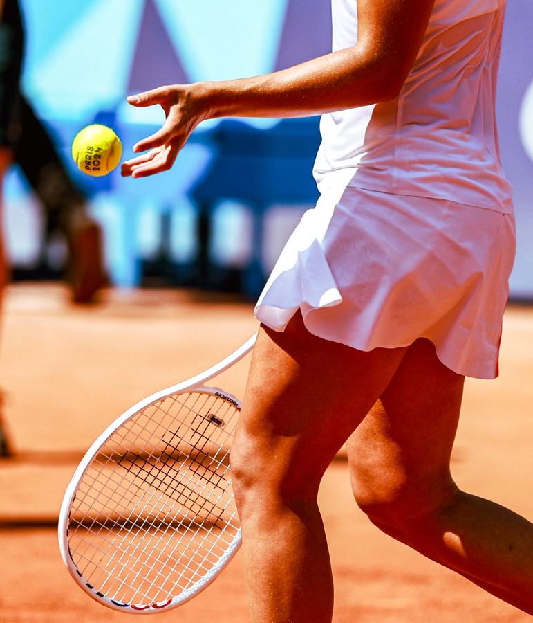 Ball toss, racket and clay