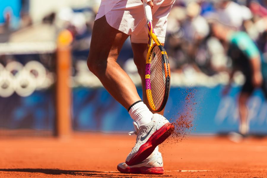 Clay kicking up off a shoe