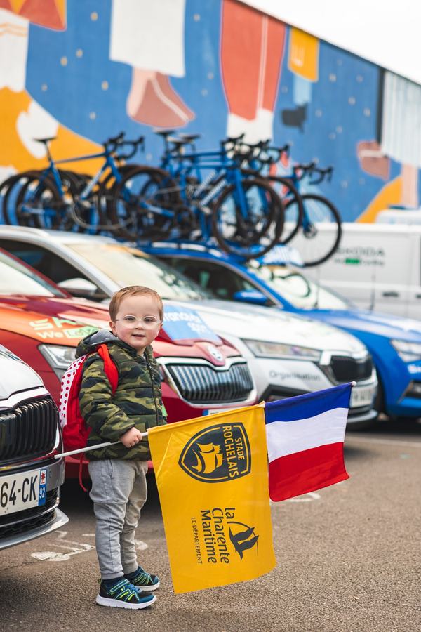 A young fan with a flag