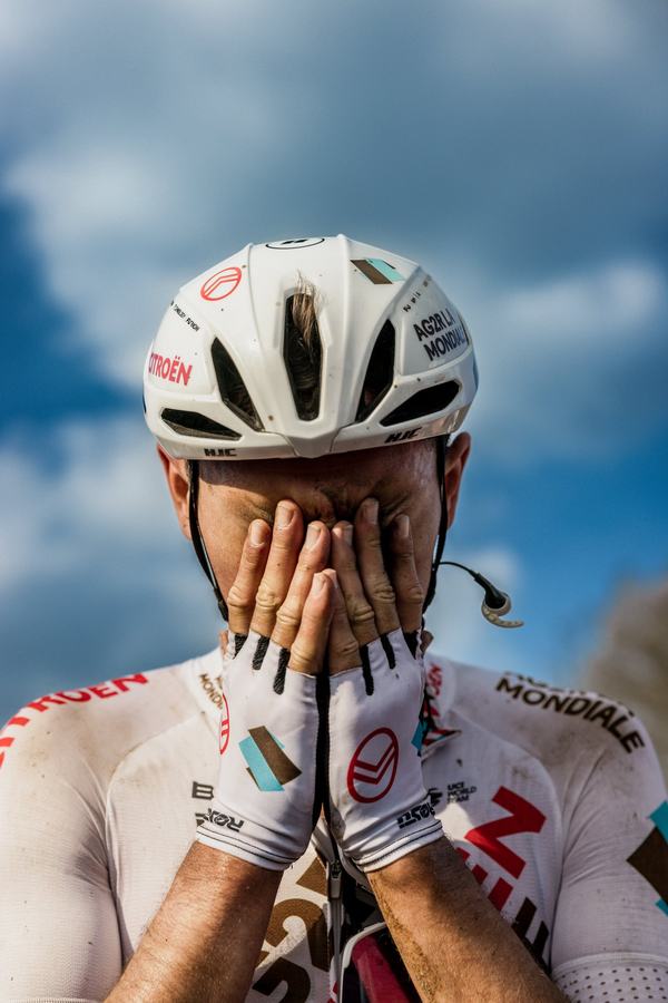Hands over the face at the finish