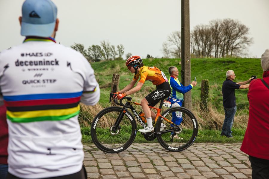 Onto the cobbles, past the rainbow jersey