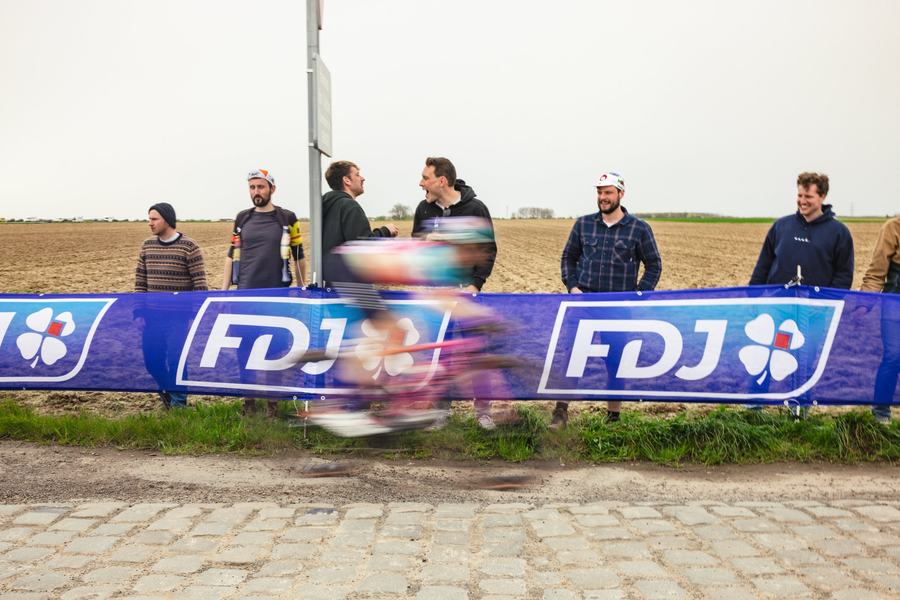 A blur past the roadside boards