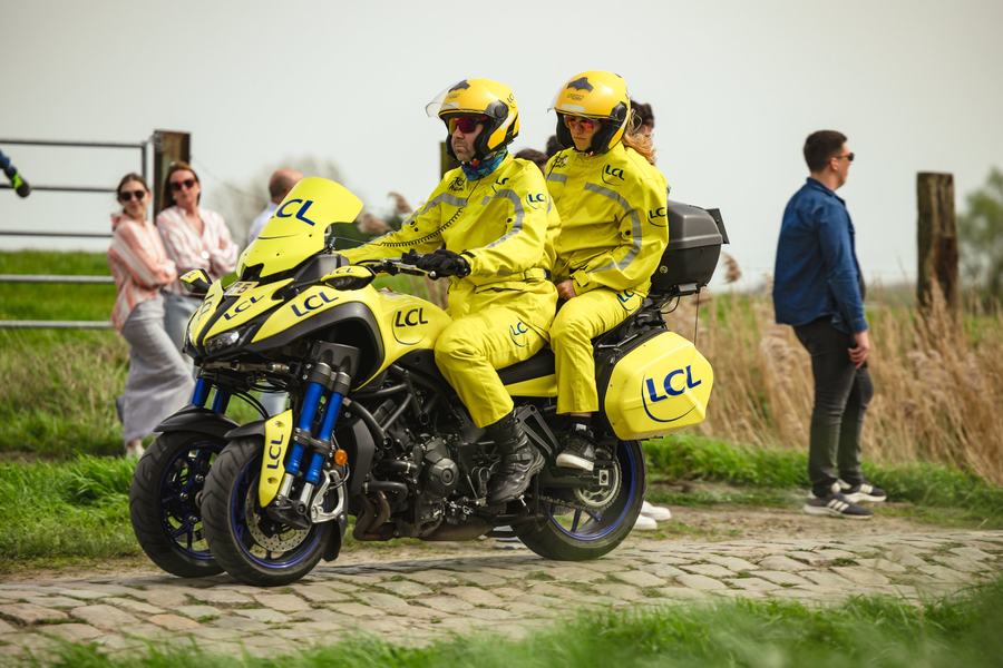 Race motos waiting on the verge