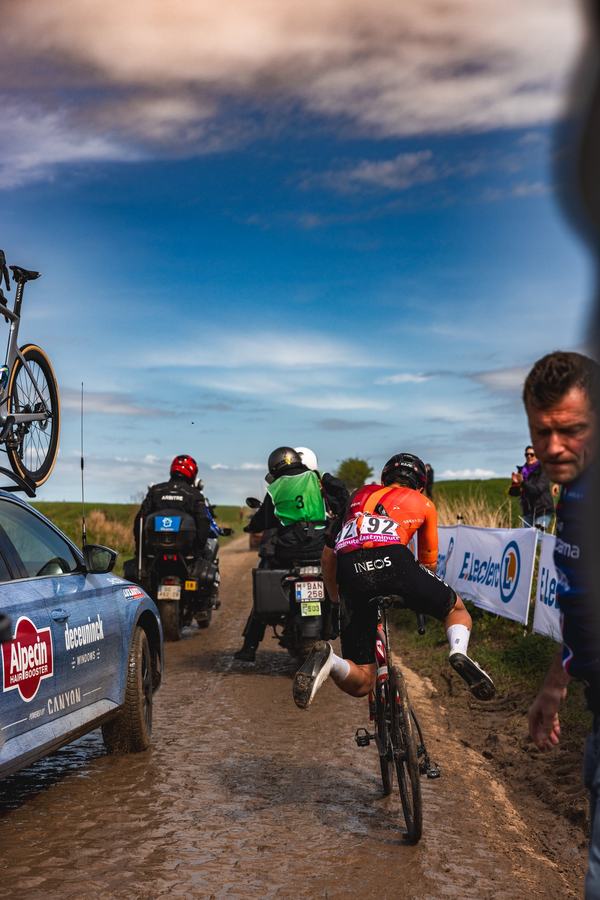 Through the mud beside the team car