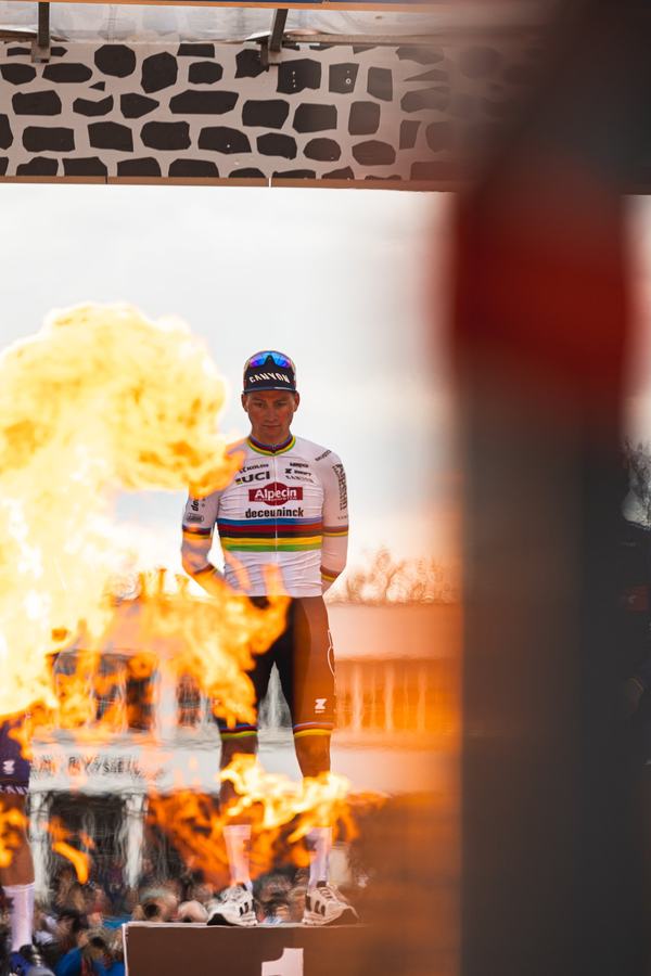 The winner, flames on the podium