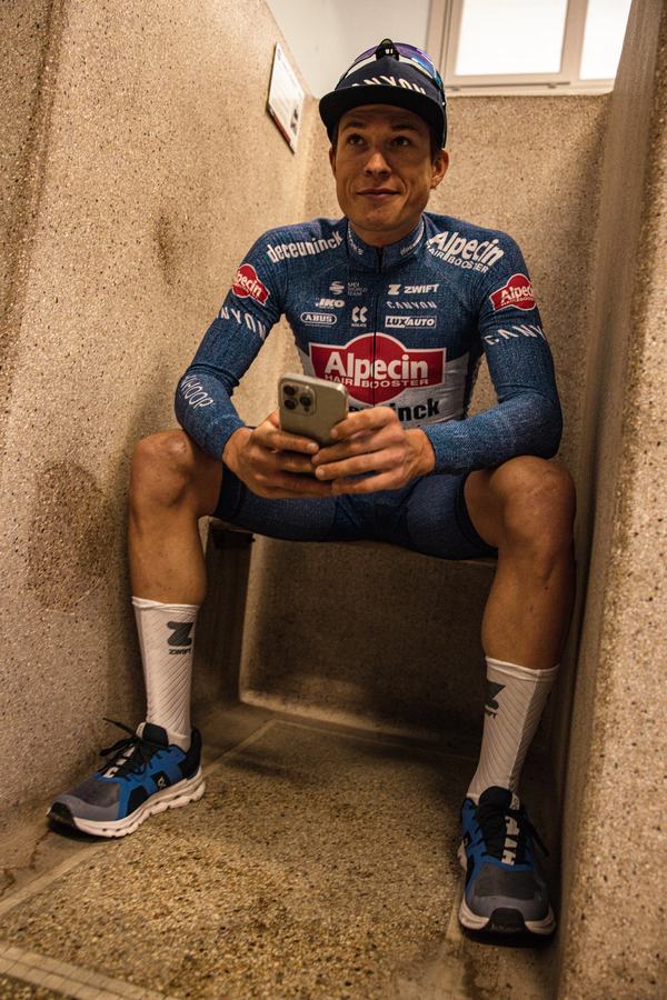 Checking the phone in the cubicle