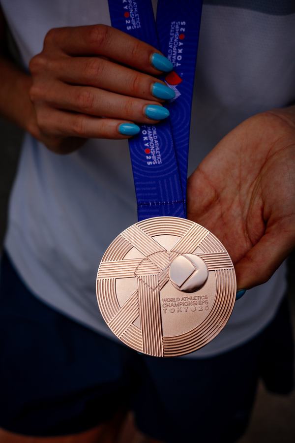 The bronze medal in her hands