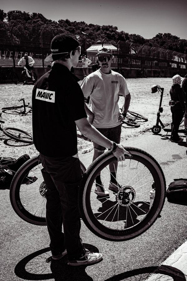A mechanic with the bike before the start