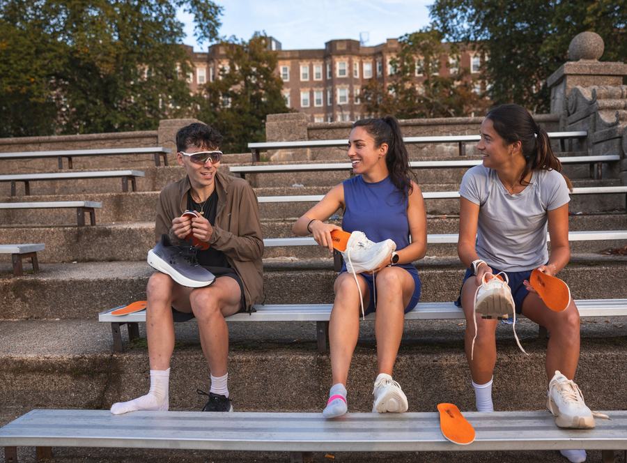 Three runners on the bleachers