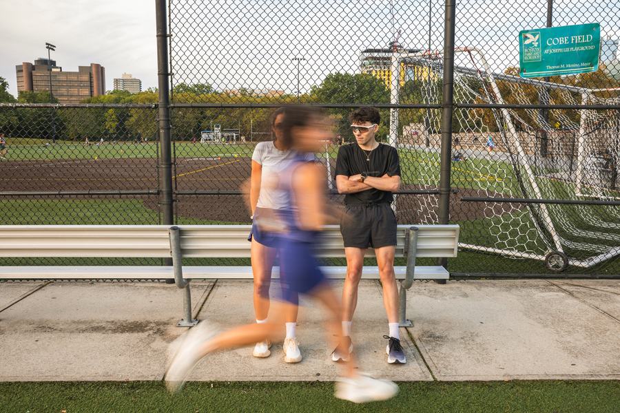 Warming up by the fence