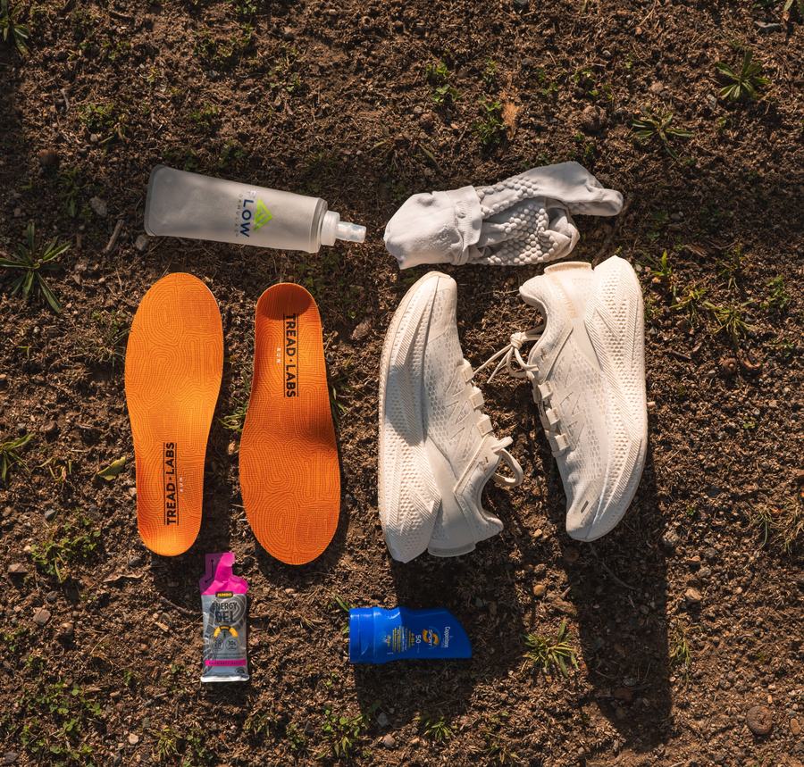 Insoles, shoes and kit laid out