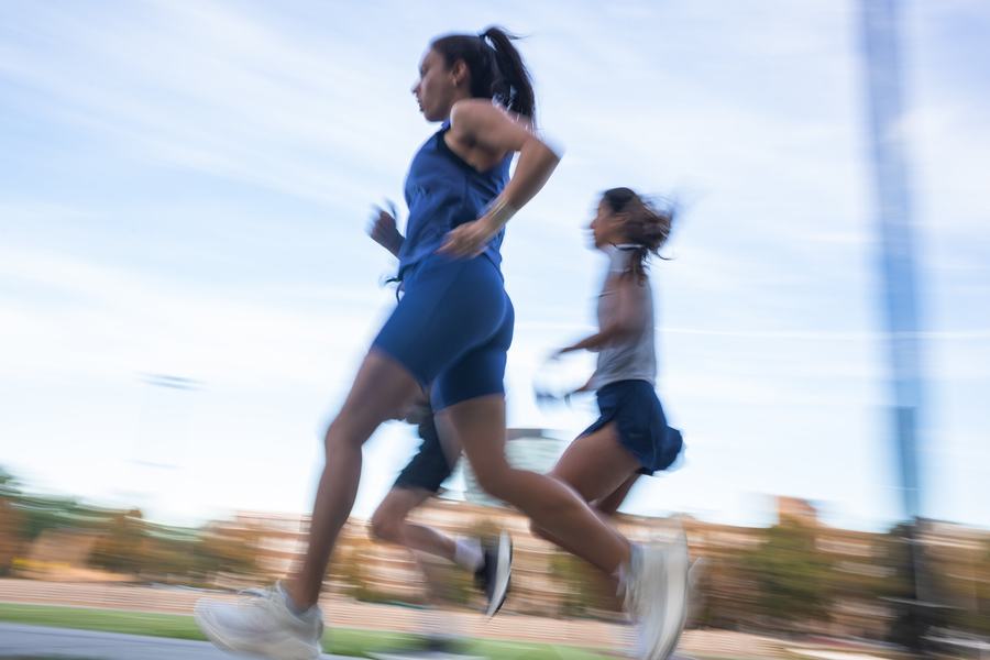 Three runners, panned blur