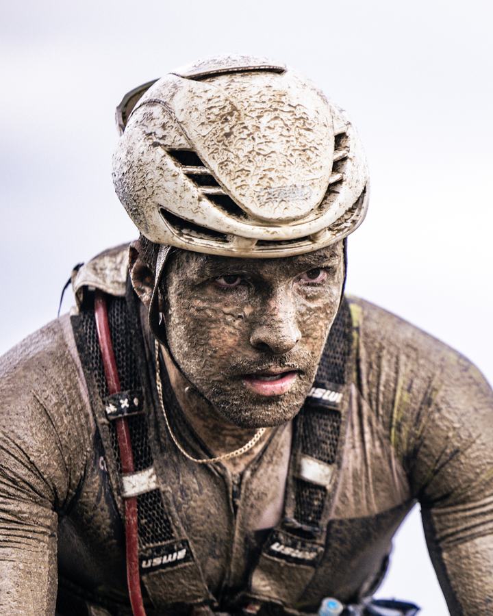 Caked in mud, still riding