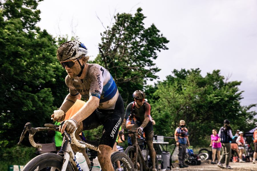 Riders climbing through the trees